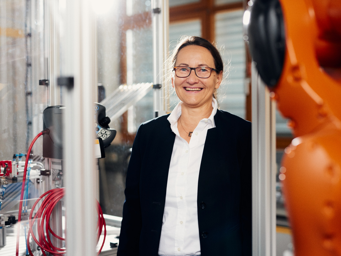 Professor Kirsten Tracht is standing in a laboratory