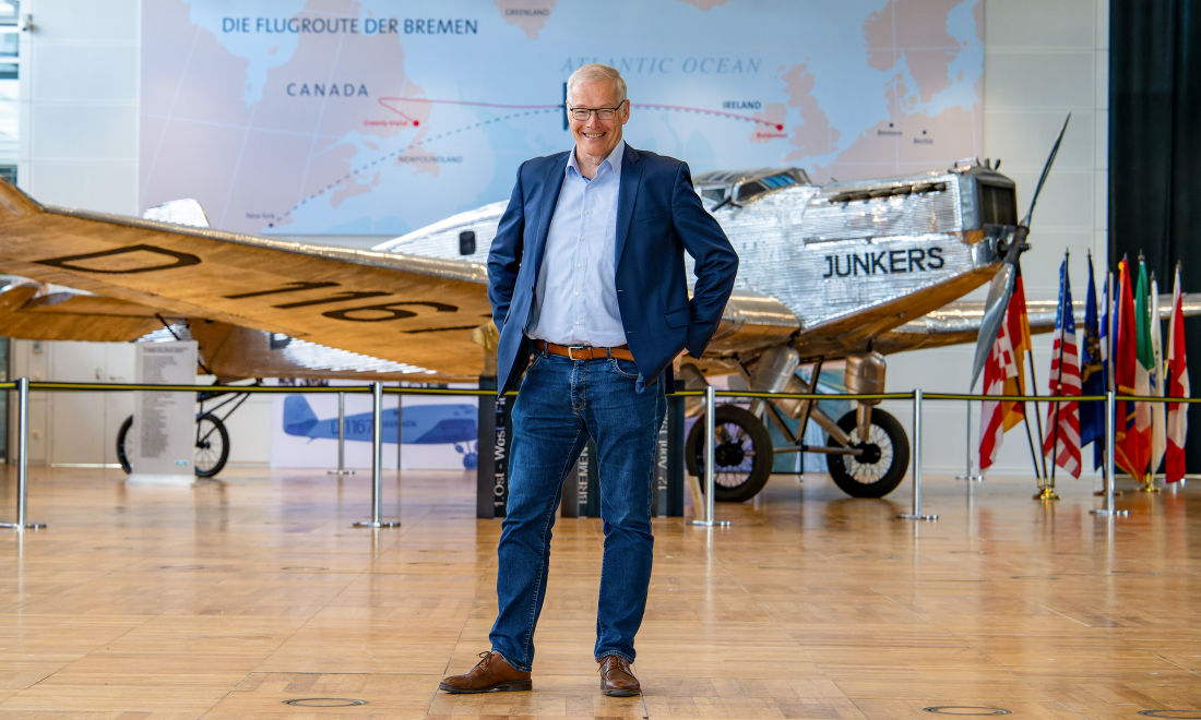 Rolf Henke in front of an airplane