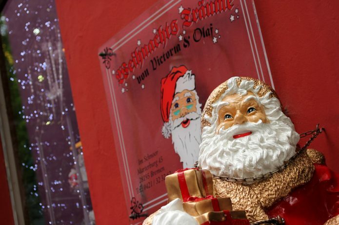 Santa Claus in front of the Christmas store in Schnoor